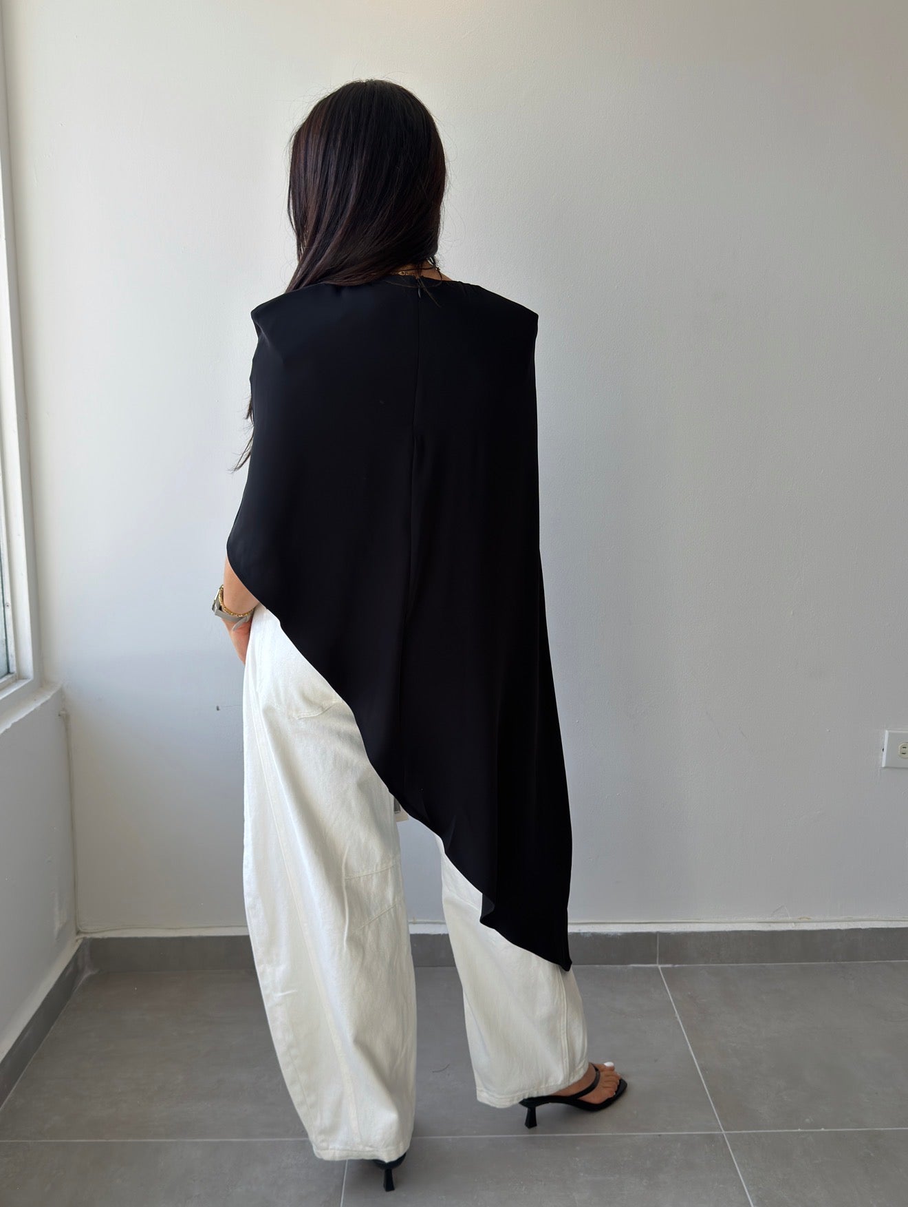 Black Asymmetric Cape